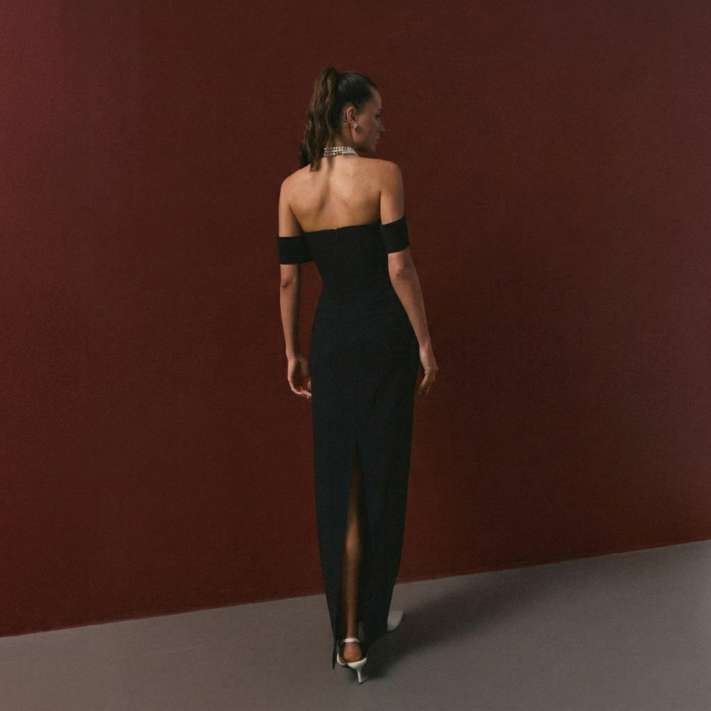 Elegant full-length corset dress featuring a stylish shoulder accent for a bold, refined look. Shop now at our exclusive clothing website.