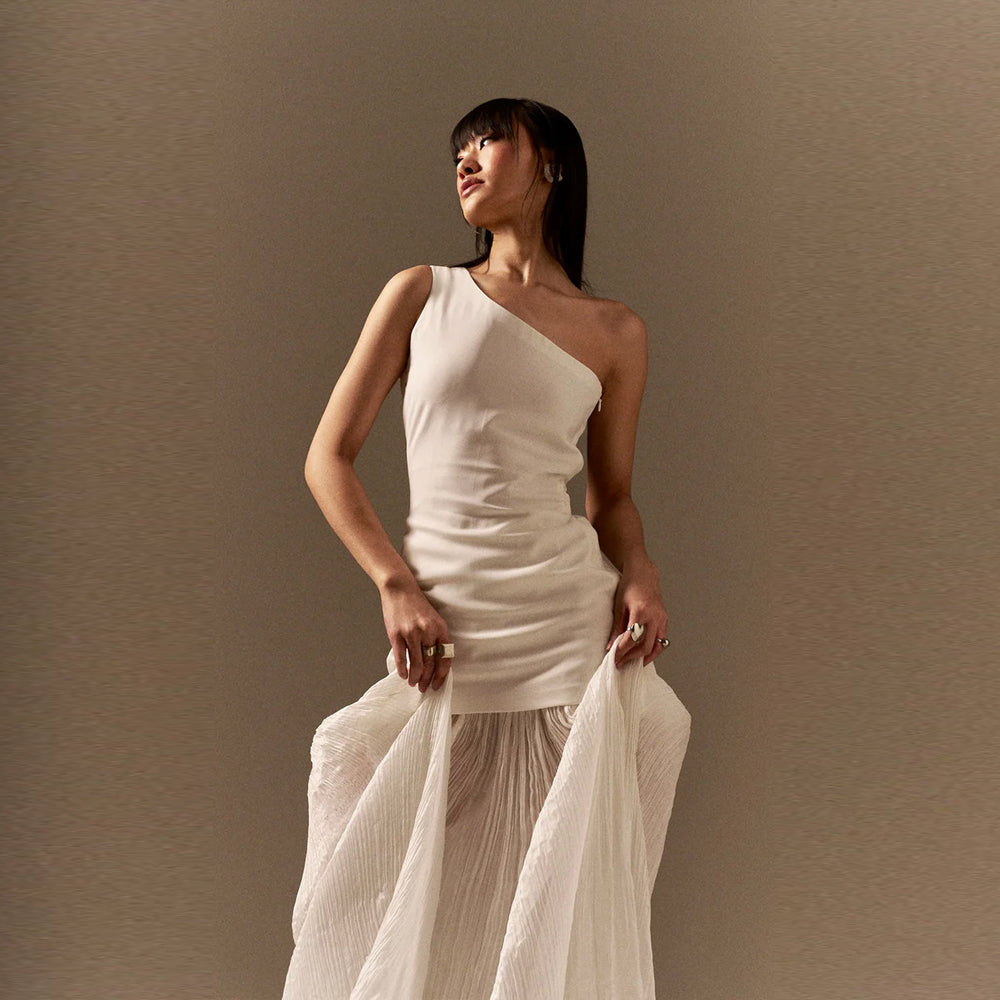 One shoulder top with chiffon skirt and tulle detail, perfect for getaways. Shop online from our curated edit of premium fashion.