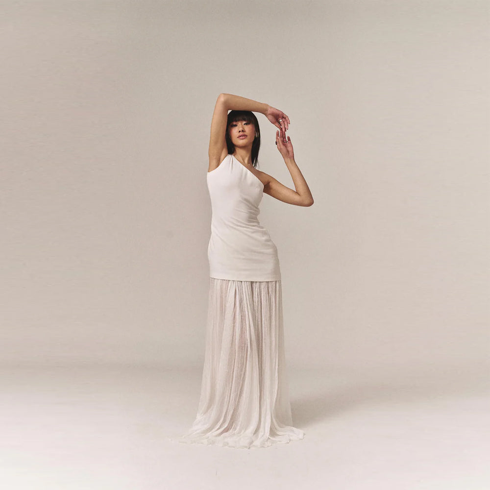 One shoulder top with chiffon skirt and tulle detail, perfect for getaways. Shop online from our curated edit of premium fashion.