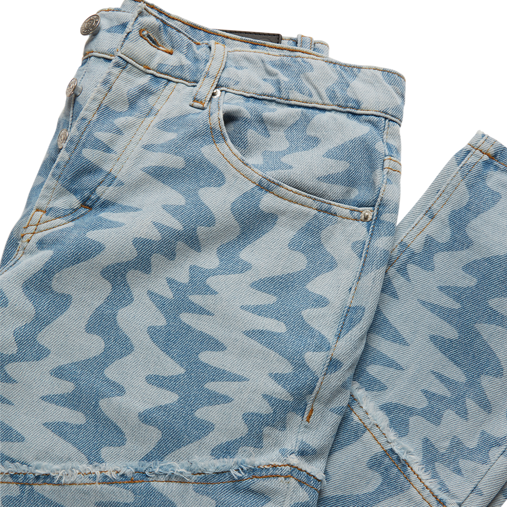 Oren light blue men's jeans are patterned with a contrast motif print. They’re crafted from rigid denim with a straight leg