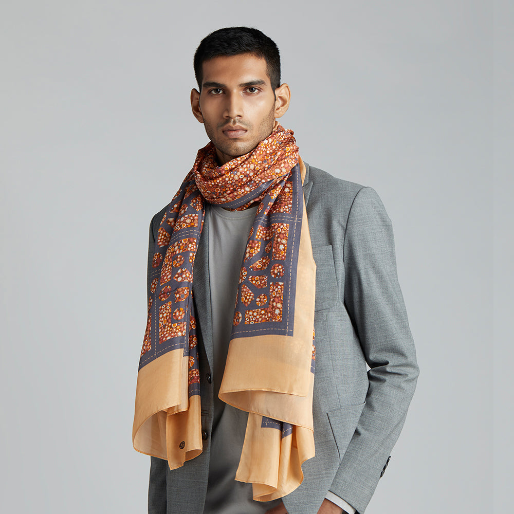 A summery print in tones of terracotta, orange, yellow and grey, with a mixture of formal geometrics.