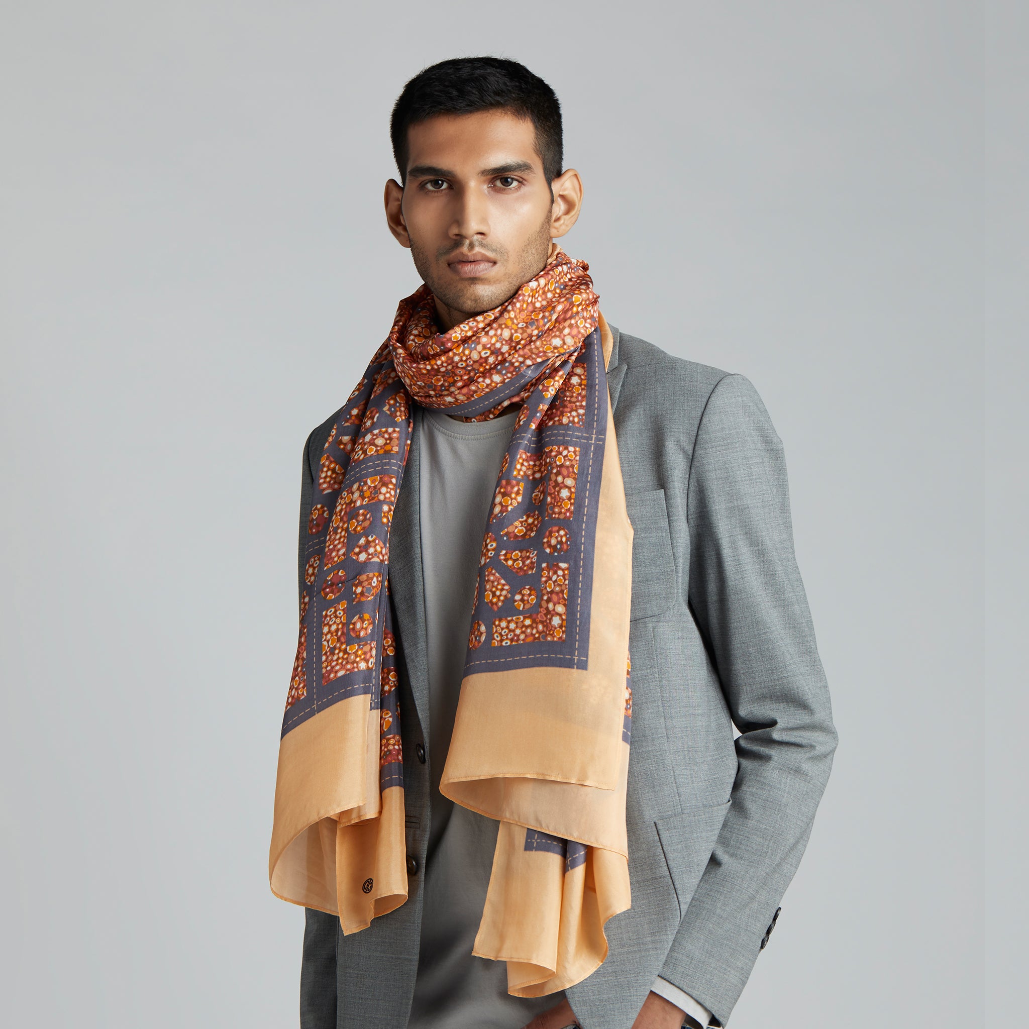 A summery print in tones of terracotta, orange, yellow and grey, with a mixture of formal geometrics.