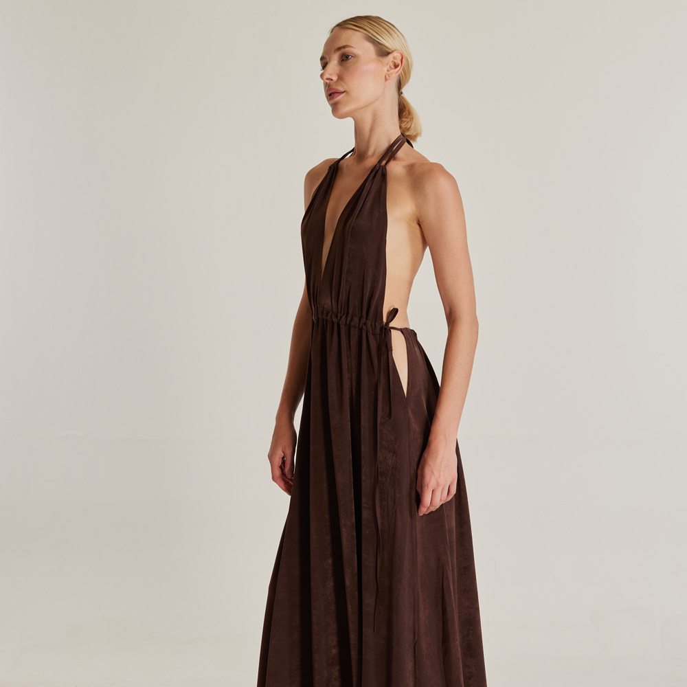 The Oasis (Vaha) dress, crafted from brown silk viscose, is a stunning piece that exudes elegance.