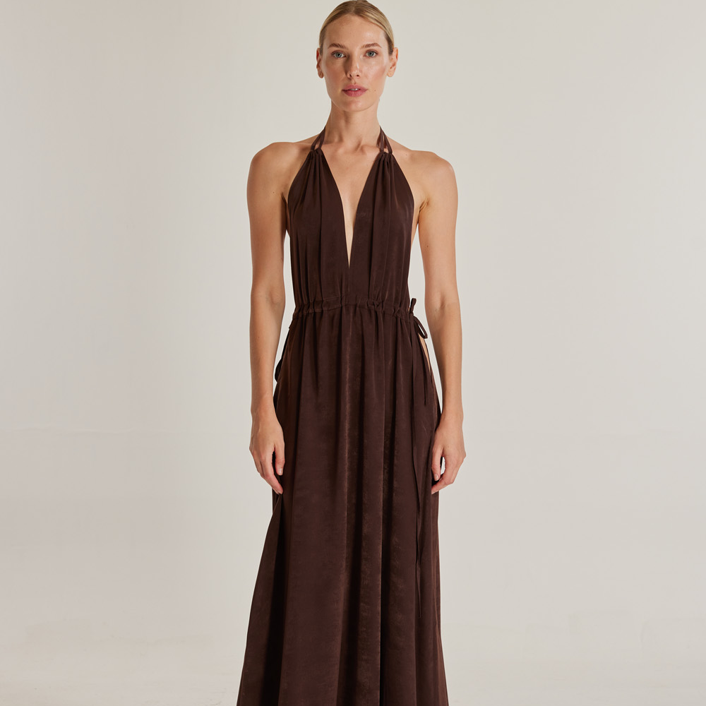 The Oasis (Vaha) dress, crafted from brown silk viscose, is a stunning piece that exudes elegance.