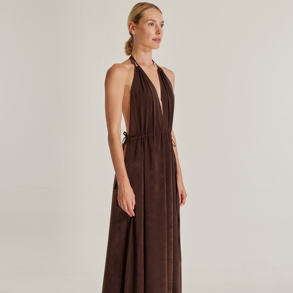 The Oasis (Vaha) dress, crafted from brown silk viscose, is a stunning piece that exudes elegance.