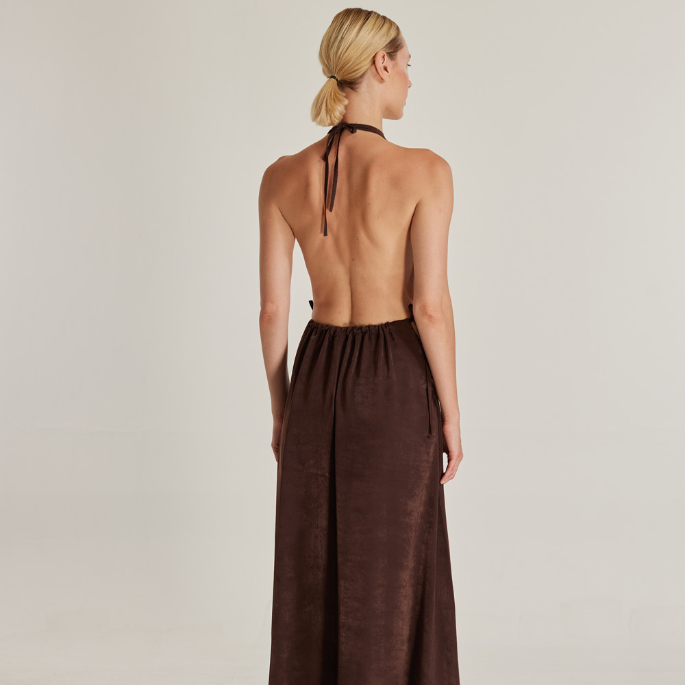 The Oasis (Vaha) dress, crafted from brown silk viscose, is a stunning piece that exudes elegance.