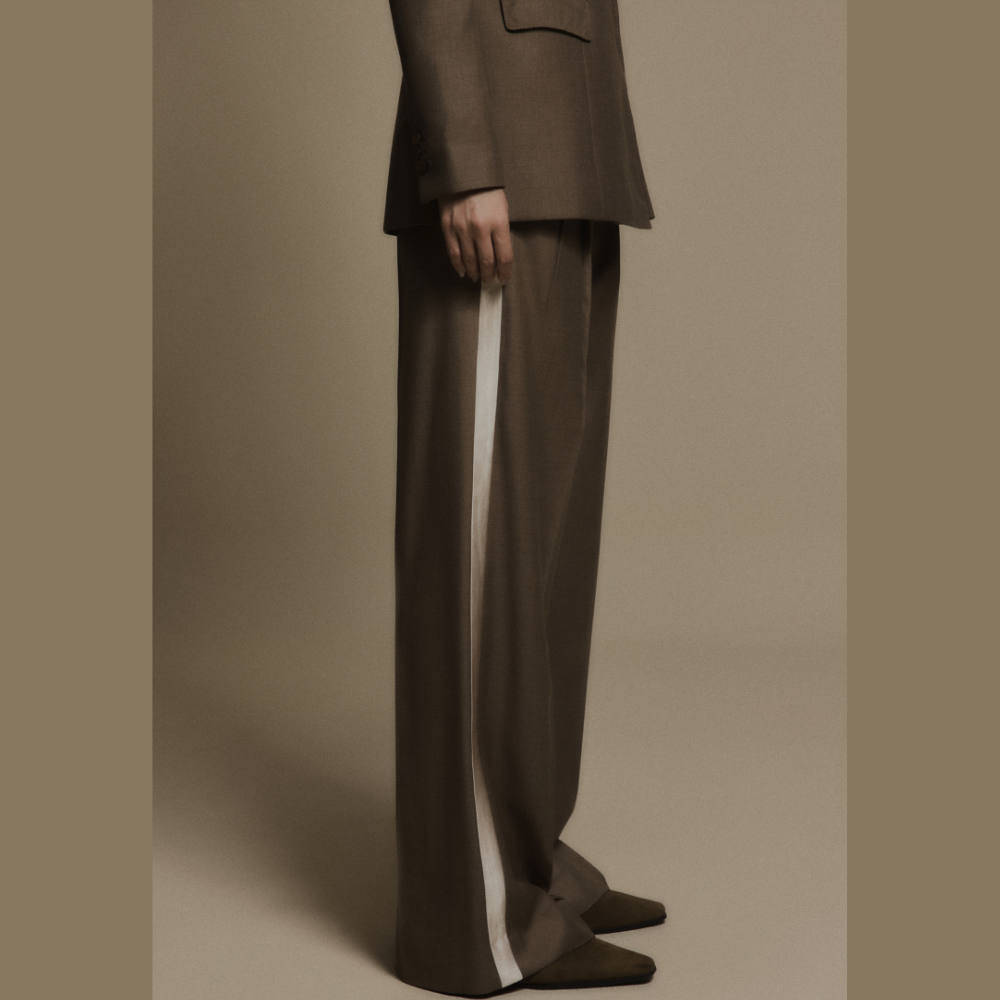 Elevate your wardrobe with women's wear essentials like the chic Obsidian Wool Trousers. Shop Now!