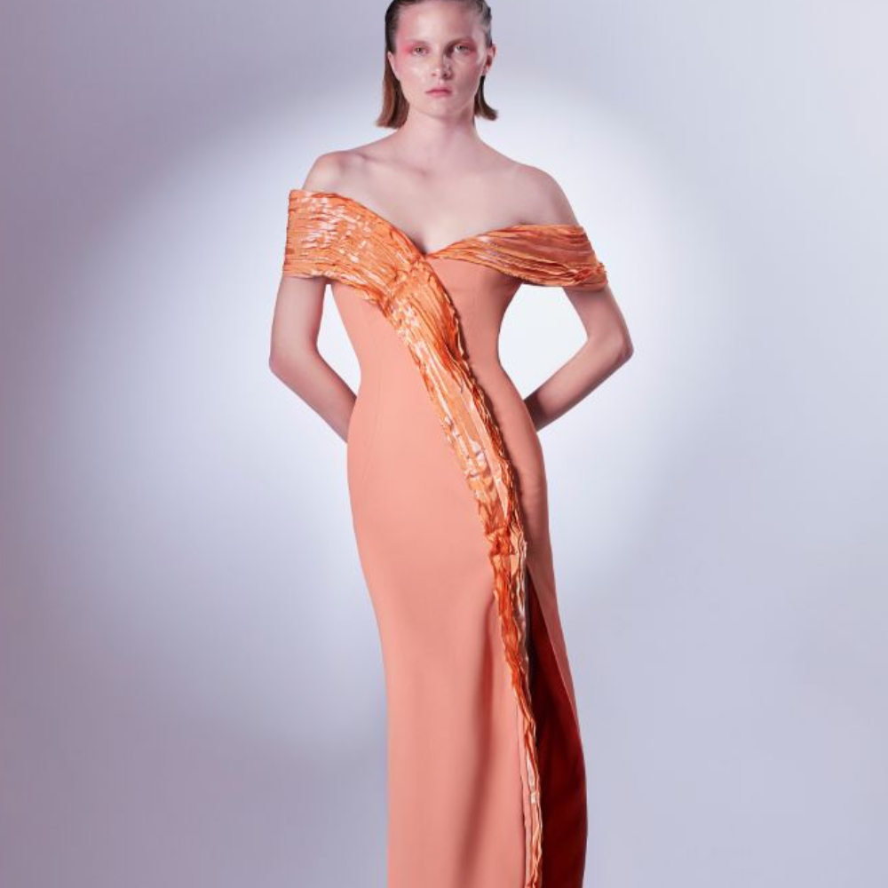 The metallic taffeta elements are created by fabric manipulation, and stem from the shoulder all the way to the floor.