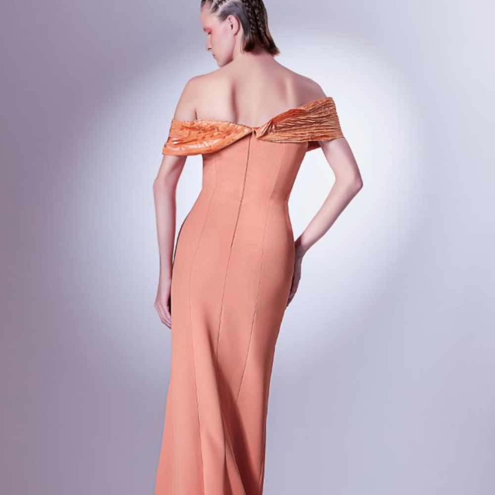 The metallic taffeta elements are created by fabric manipulation, and stem from the shoulder all the way to the floor.