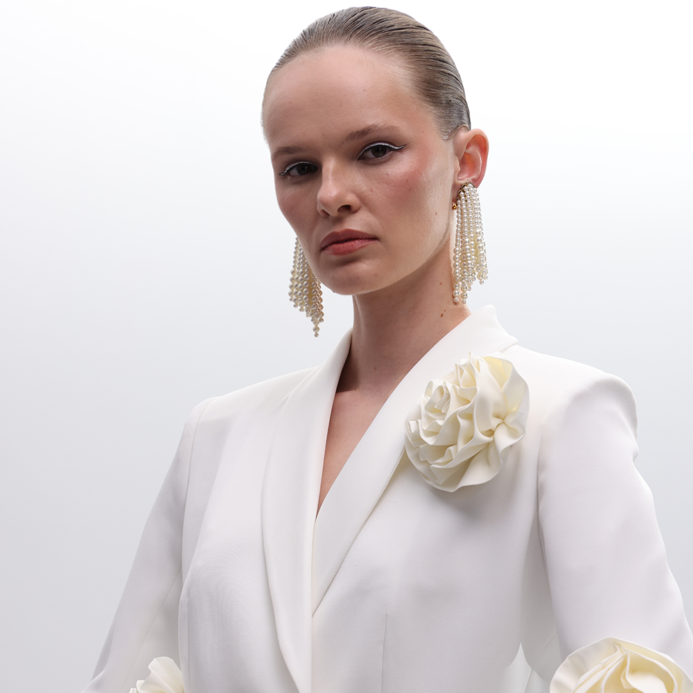 Introducing the Off White Hourglass Blazer, featuring sophisticated front buttons and a classic lapel collar.