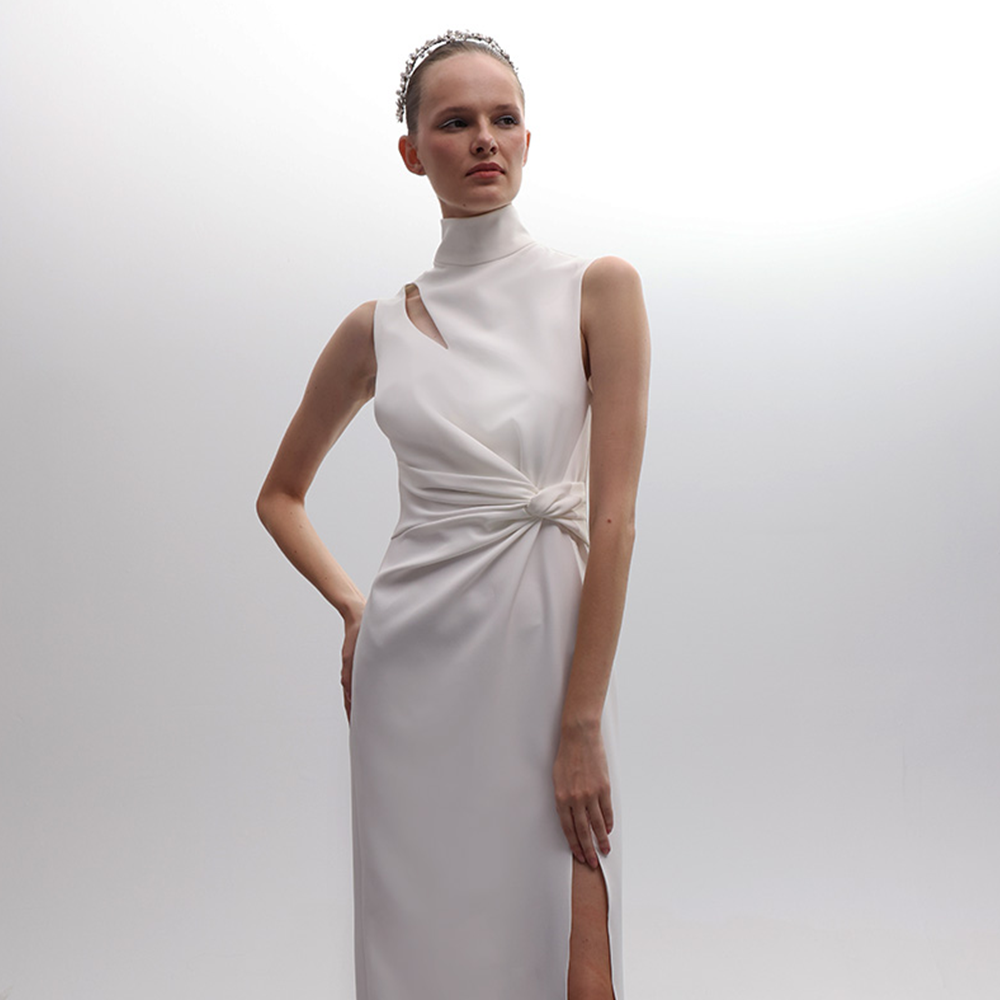 Discover the elegance of our Off White Twist Knot Halter Neck Feather Dress, a luxury designer dress perfect for upscale events. Shop Now!