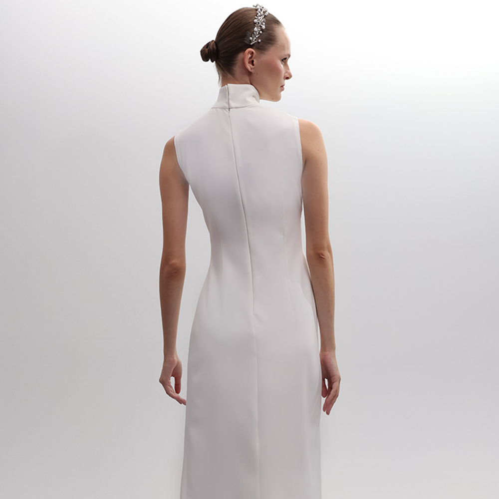 Introducing the Twist Knot Halter Neck Feather Dress with a tear drop opening.