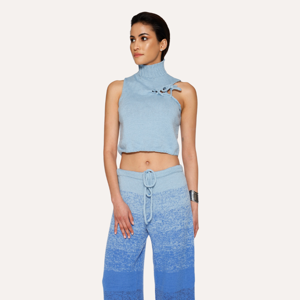 Shop online from our exclusive website. Discover the Ombre Bleu Merino Wool Sweater, hand-knitted by artisans with a soft gradient effect and a unique finish.
