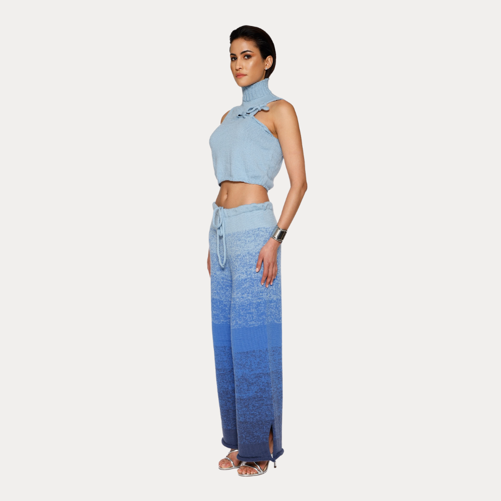 Shop online from our exclusive website. Discover the Ombre Bleu Merino Wool Sweater, hand-knitted by artisans with a soft gradient effect and a unique finish.
