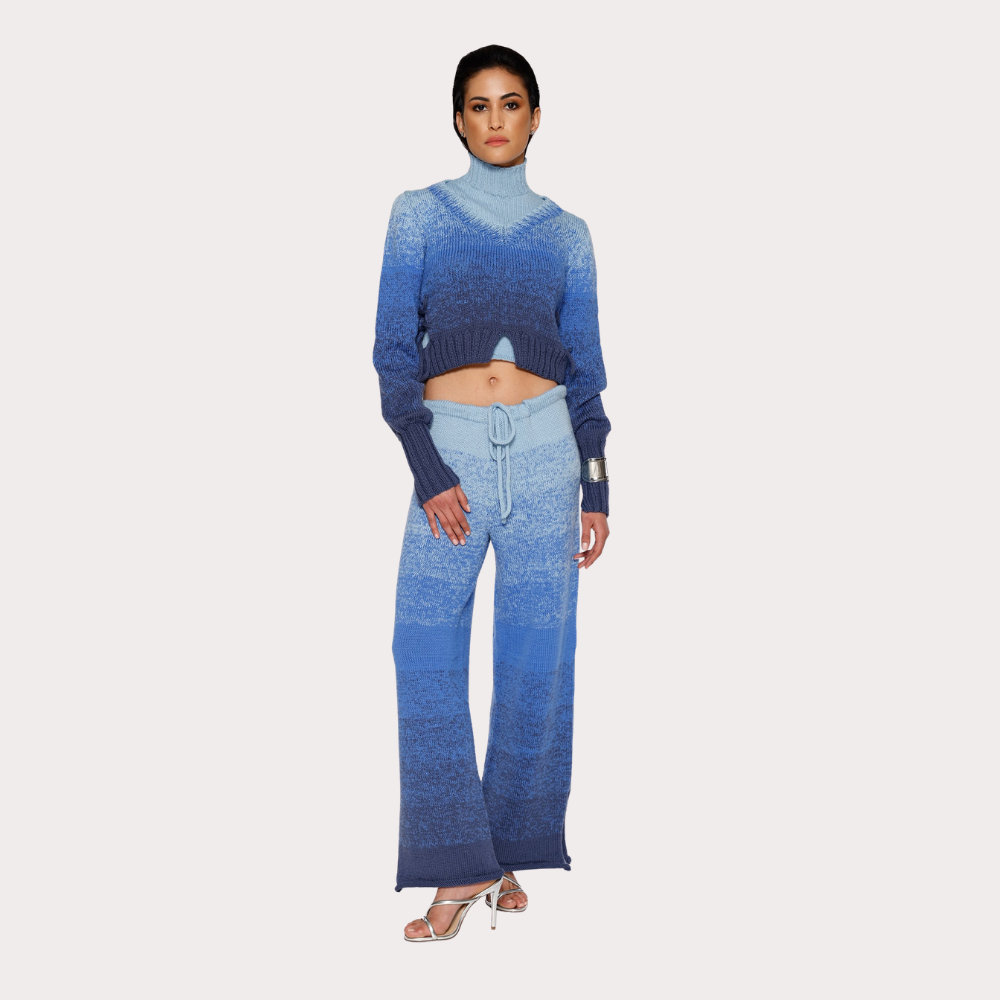 Shop online from our exclusive website. Discover the Ombre Bleu Merino Wool Sweater, hand-knitted by artisans with a soft gradient effect and a unique finish.
