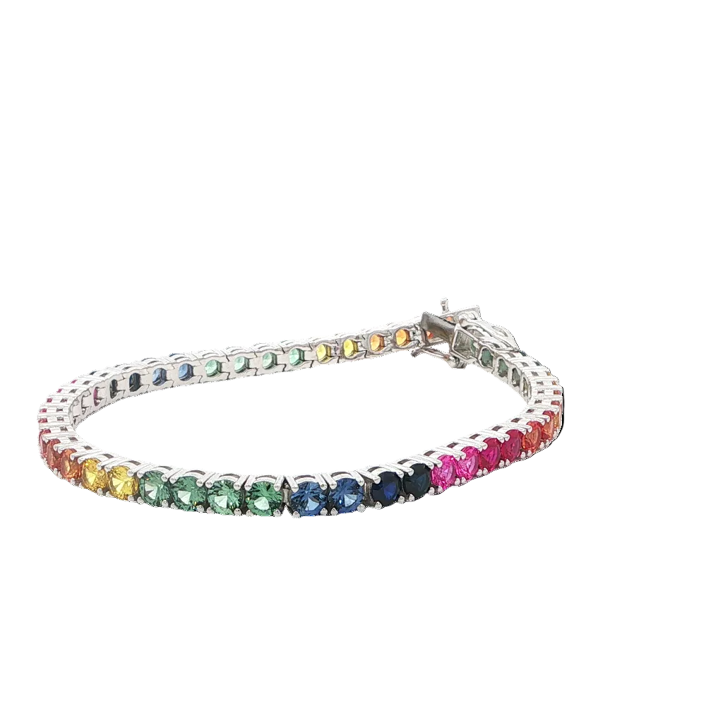 Rhodium-plated sterling silver rainbow ombre bracelet with lab-created yellow, pink, orange, blue, and green sapphire stones with ruby accents for a vibrant modern look. Shop premium jewelry online.