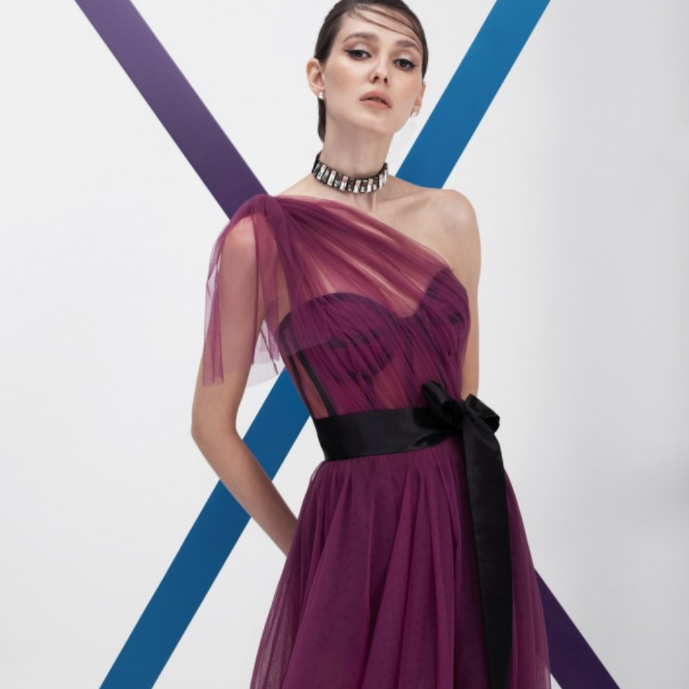 One shoulder, floor-length long dress. Multi-layered purple tulle dress with short pants and black belt.