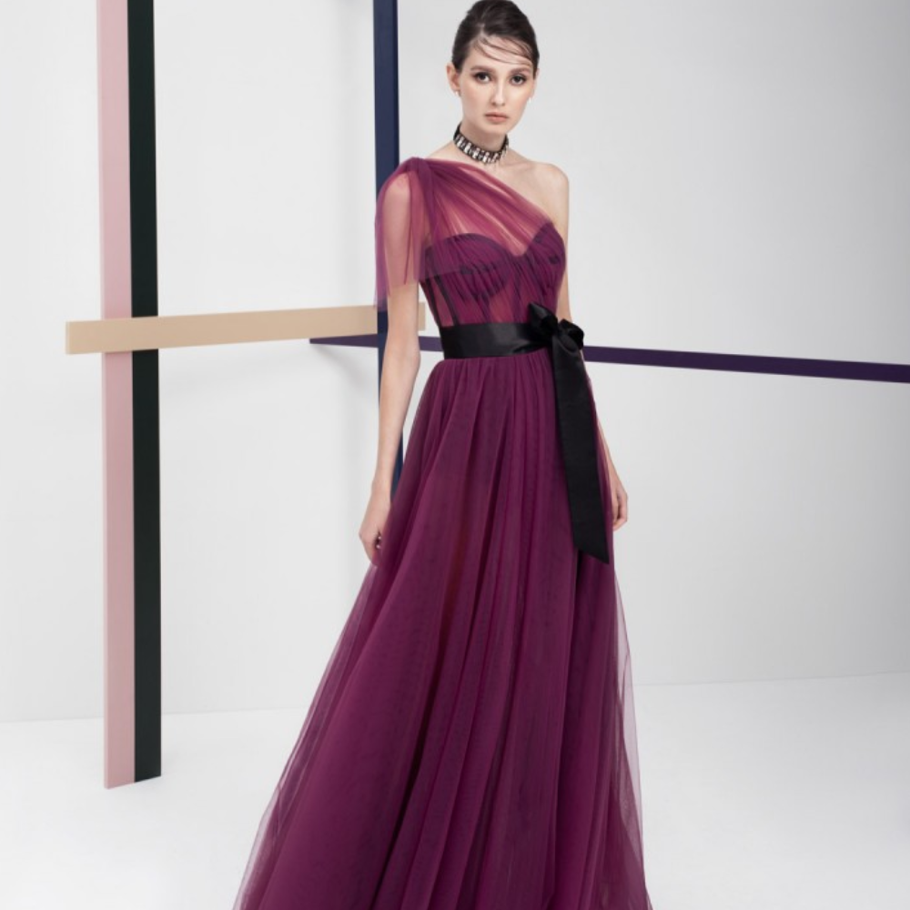 One shoulder, floor-length long dress. Multi-layered purple tulle dress with short pants and black belt.