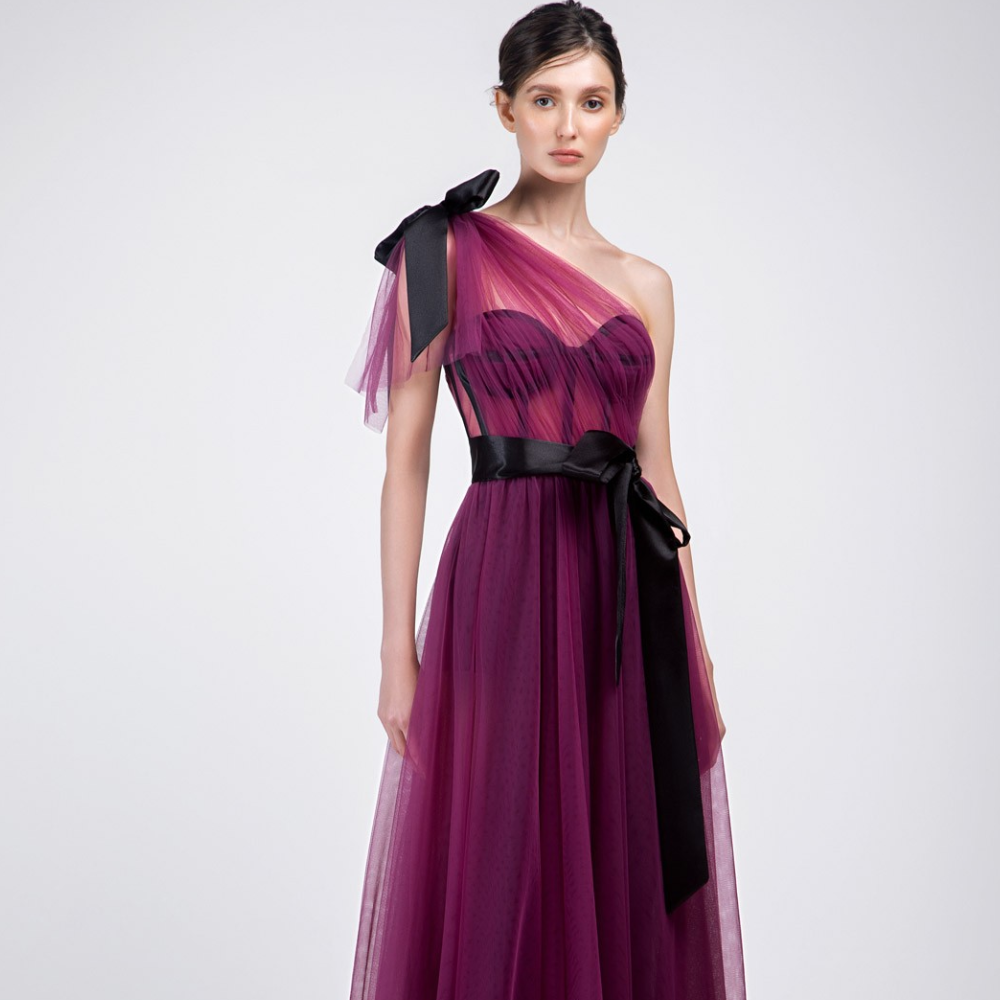 One shoulder, floor-length long dress. Multi-layered purple tulle dress with short pants and black belt.