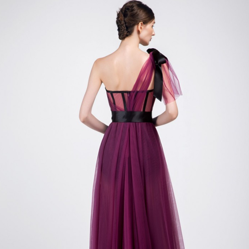 One shoulder, floor-length long dress. Multi-layered purple tulle dress with short pants and black belt.