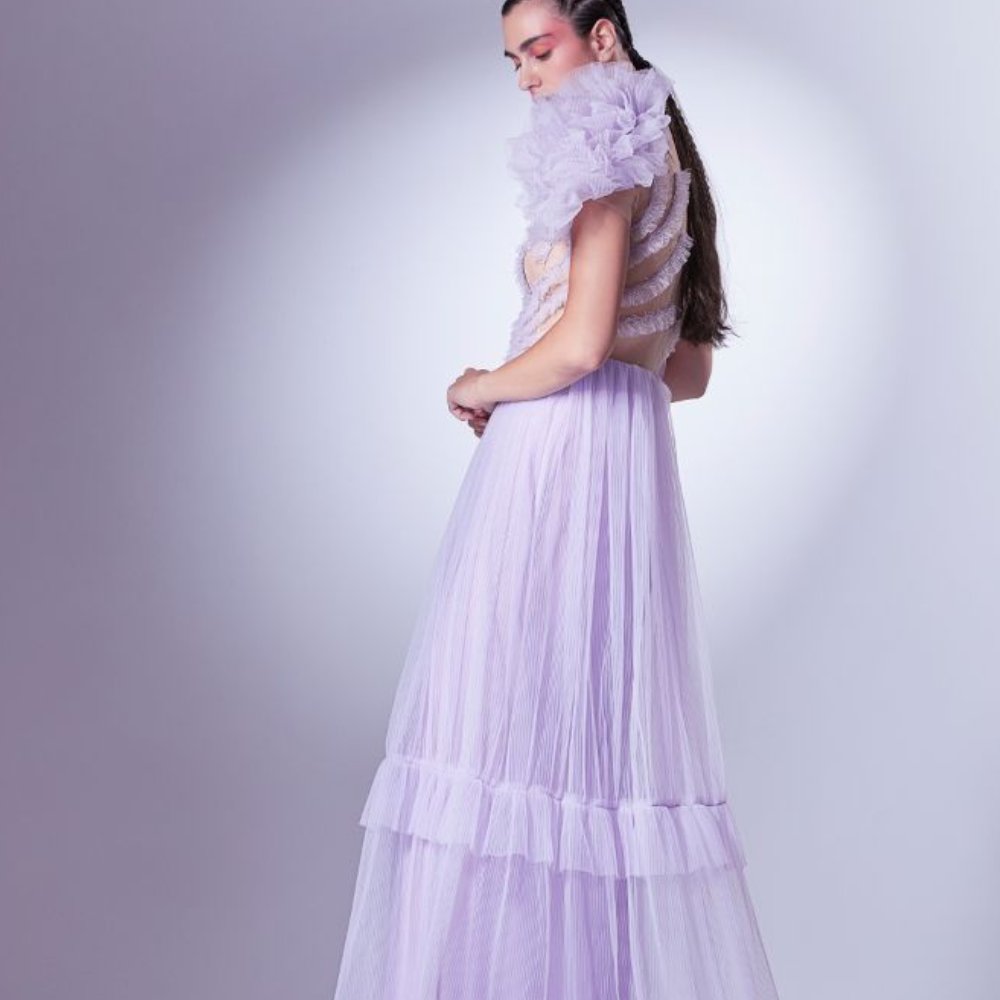 Multiple layers of frills dance romantically with the lilac dress, sometimes slowly on the bust.