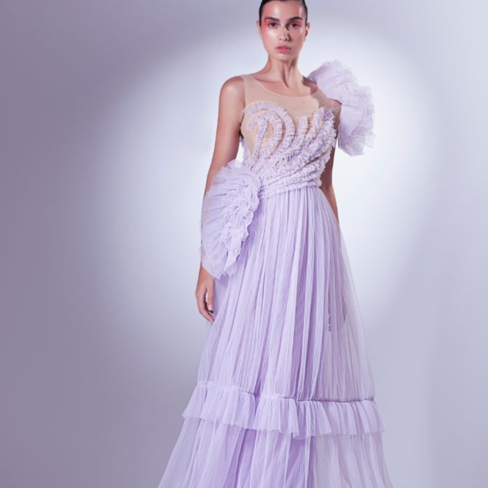 Multiple layers of frills dance romantically with the lilac dress, sometimes slowly on the bust.