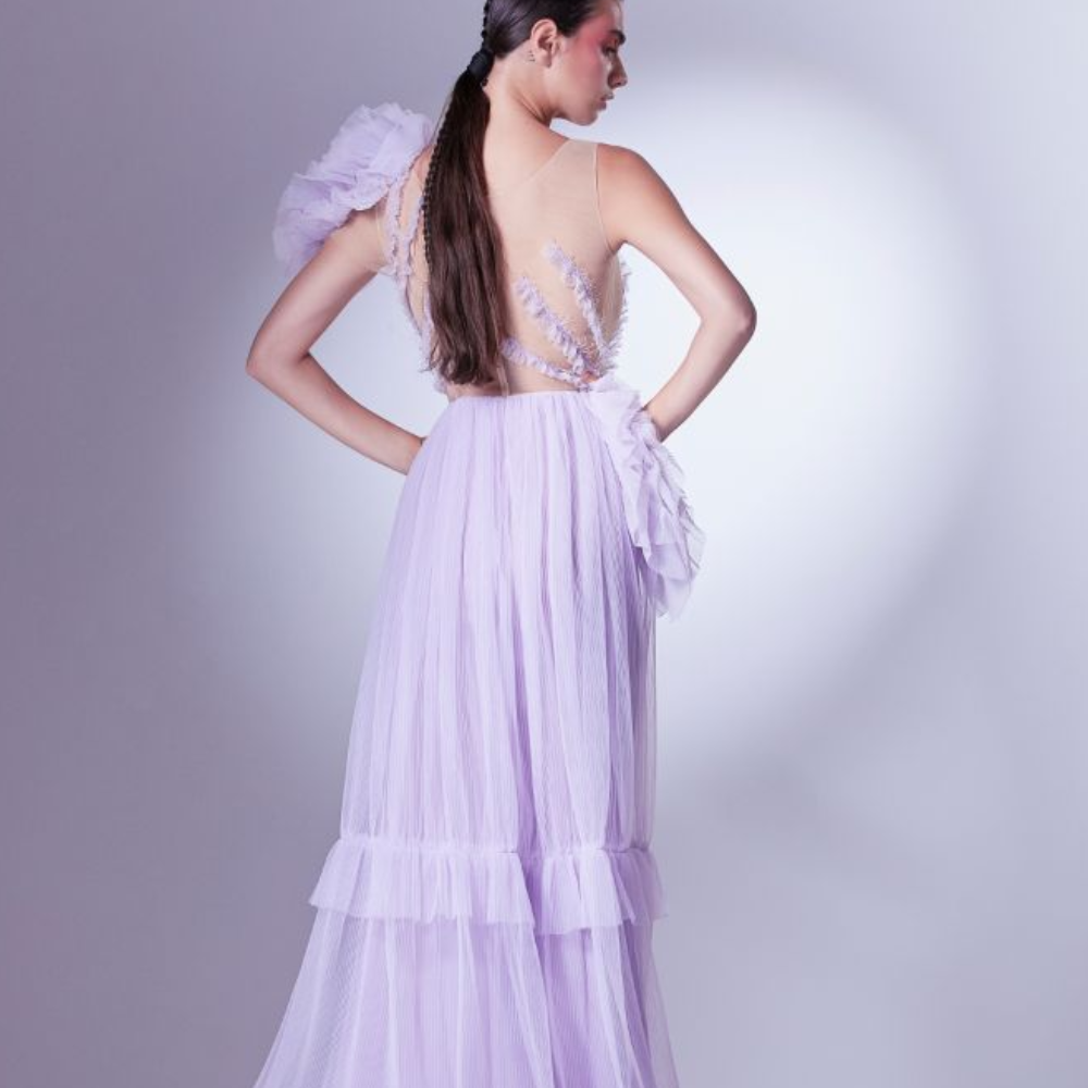 Multiple layers of frills dance romantically with the lilac dress, sometimes slowly on the bust.