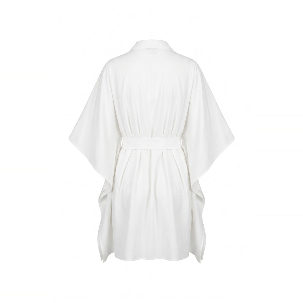 Shop online from our exclusive website and discover the Organic Cotton Kaftan Shirt Dress in White by Benedetti Life, crafted from premium organic cotton for breathable comfort and timeless minimalist elegance.