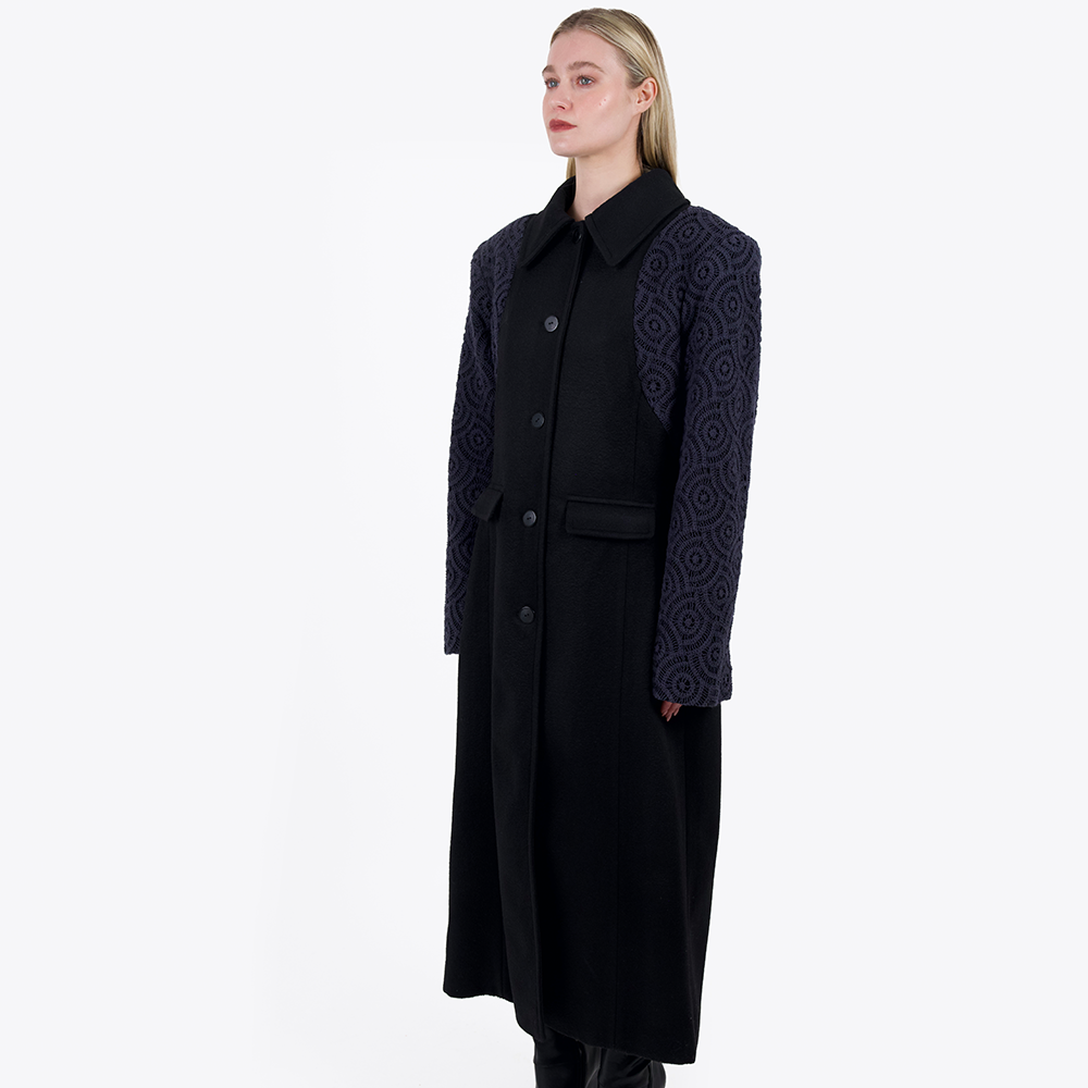 This oversized tailored coat has been made with luxury deadstock heavy weight wool with cotton crochet overlayed sleeves. 