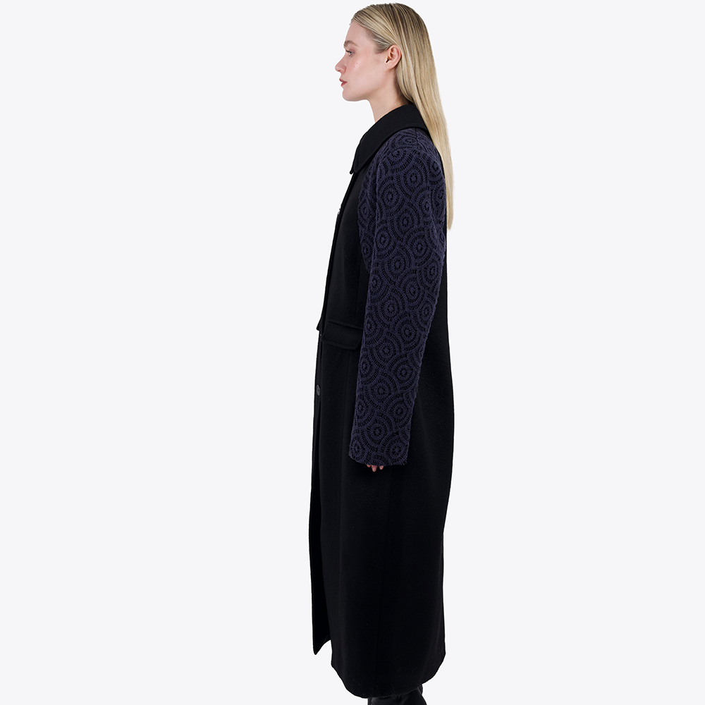 This oversized tailored coat has been made with luxury deadstock heavy weight wool with cotton crochet overlayed sleeves. 