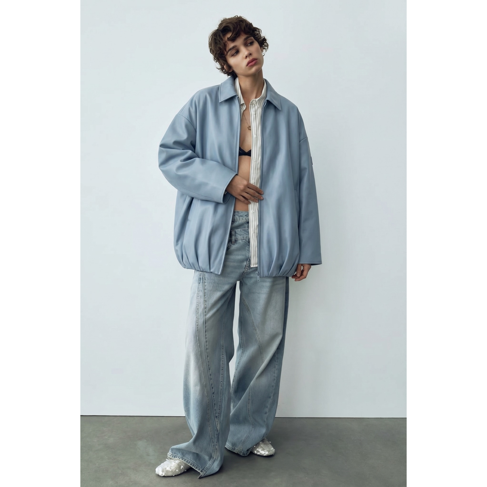 Shop online from our exclusive website and discover the Oversized Olive Leather Bomber Jacket in Ice Blue by Benedetti Life, crafted from Oleatex® plant-based leather for sustainable modern luxury.