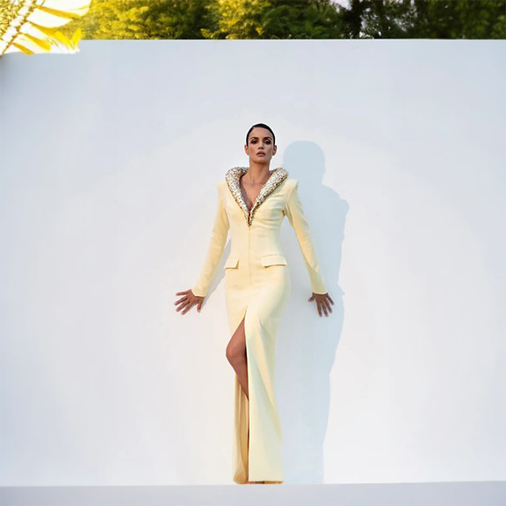 A light yellow crepe coatdress with a crystal embroidered lapel.