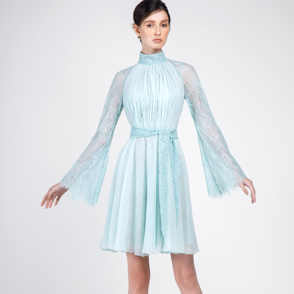 This dress is pastel green knee-length with high collar. Full sleeves and belt on waist.