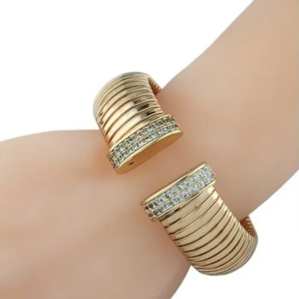 1 CTTW Pave Cubic Zirconia open cuff bracelet. Set in 18k gold plated brass.