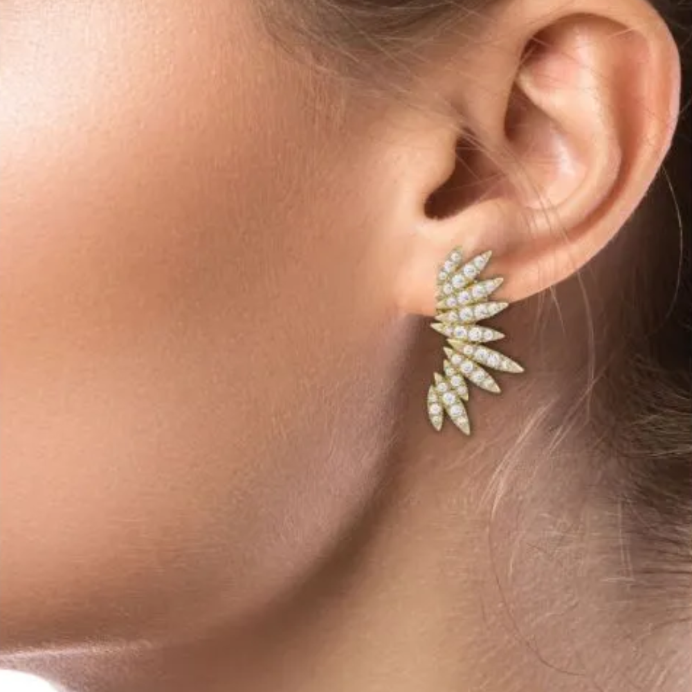 4 CTTW pave cubic zirconia spike earrings. Earrings set in 18k gold plated brass.