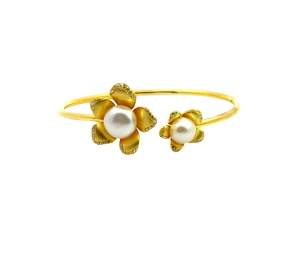 Sterling silver 18k gold-dipped bracelet with freshwater pearl and sparkling cubic zirconia accents for a polished timeless look. Shop premium jewelry online.