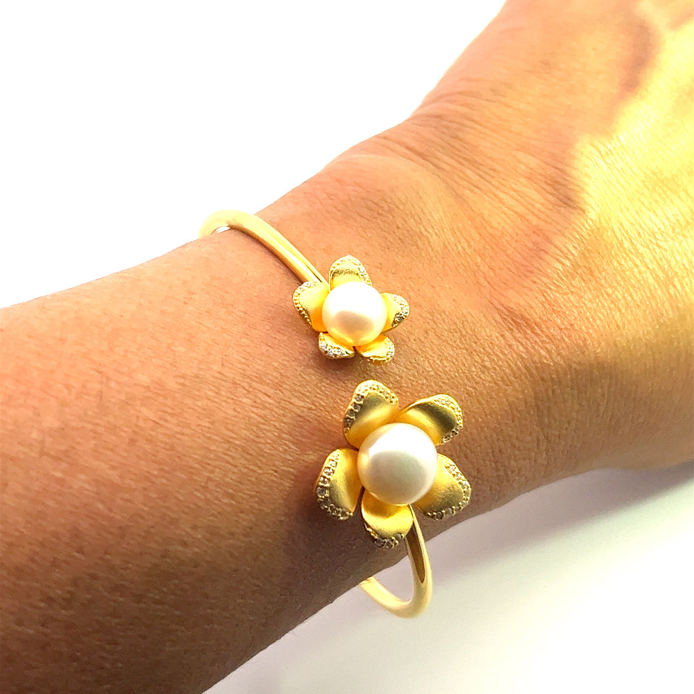Sterling silver 18k gold-dipped bracelet with freshwater pearl and sparkling cubic zirconia accents for a polished timeless look. Shop premium jewelry online.