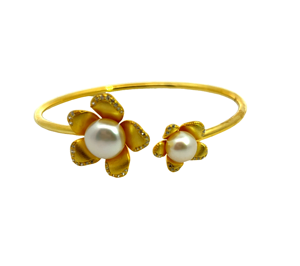 Sterling silver 18k gold-dipped bracelet with freshwater pearl and sparkling cubic zirconia accents for a polished timeless look. Shop premium jewelry online.