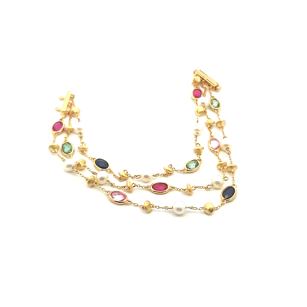 Sterling silver 18k gold-dipped bracelet with freshwater pearls and lab-created ruby, pink, blue, and green sapphire stones for a vibrant modern look. Shop premium jewelry online.