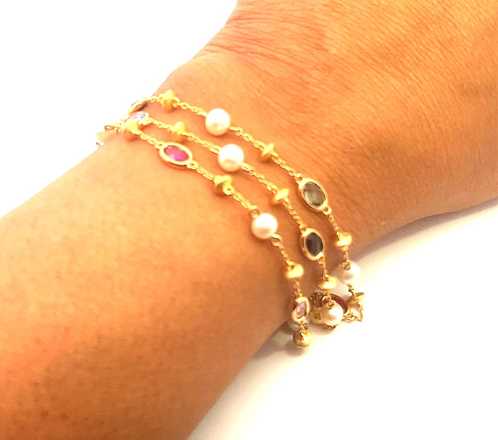 Sterling silver 18k gold-dipped bracelet with freshwater pearls and lab-created ruby, pink, blue, and green sapphire stones for a vibrant modern look. Shop premium jewelry online.