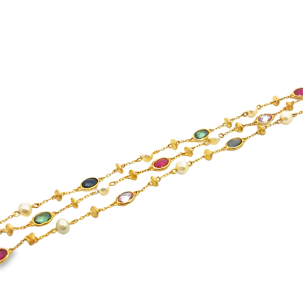 Sterling silver 18k gold-dipped bracelet with freshwater pearls and lab-created ruby, pink, blue, and green sapphire stones for a vibrant modern look. Shop premium jewelry online.