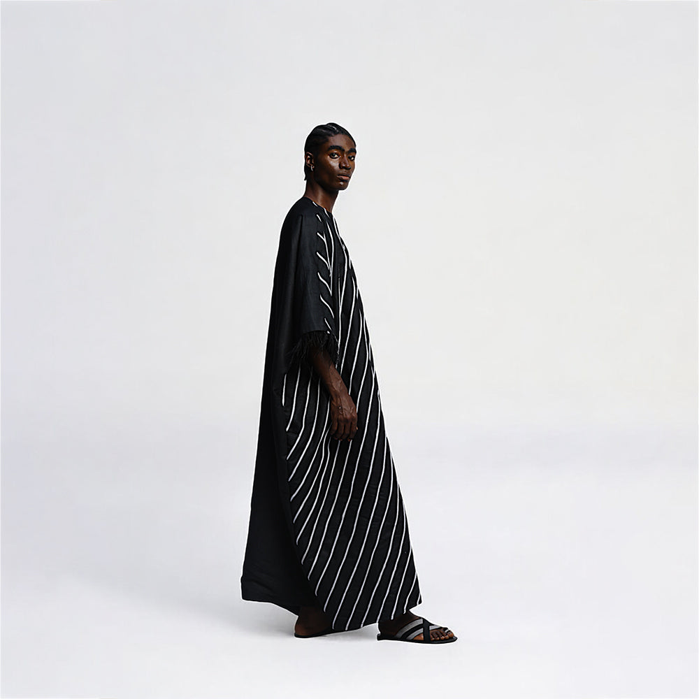 Step into style with the Pele Boubou's sophistication. Shop Now!