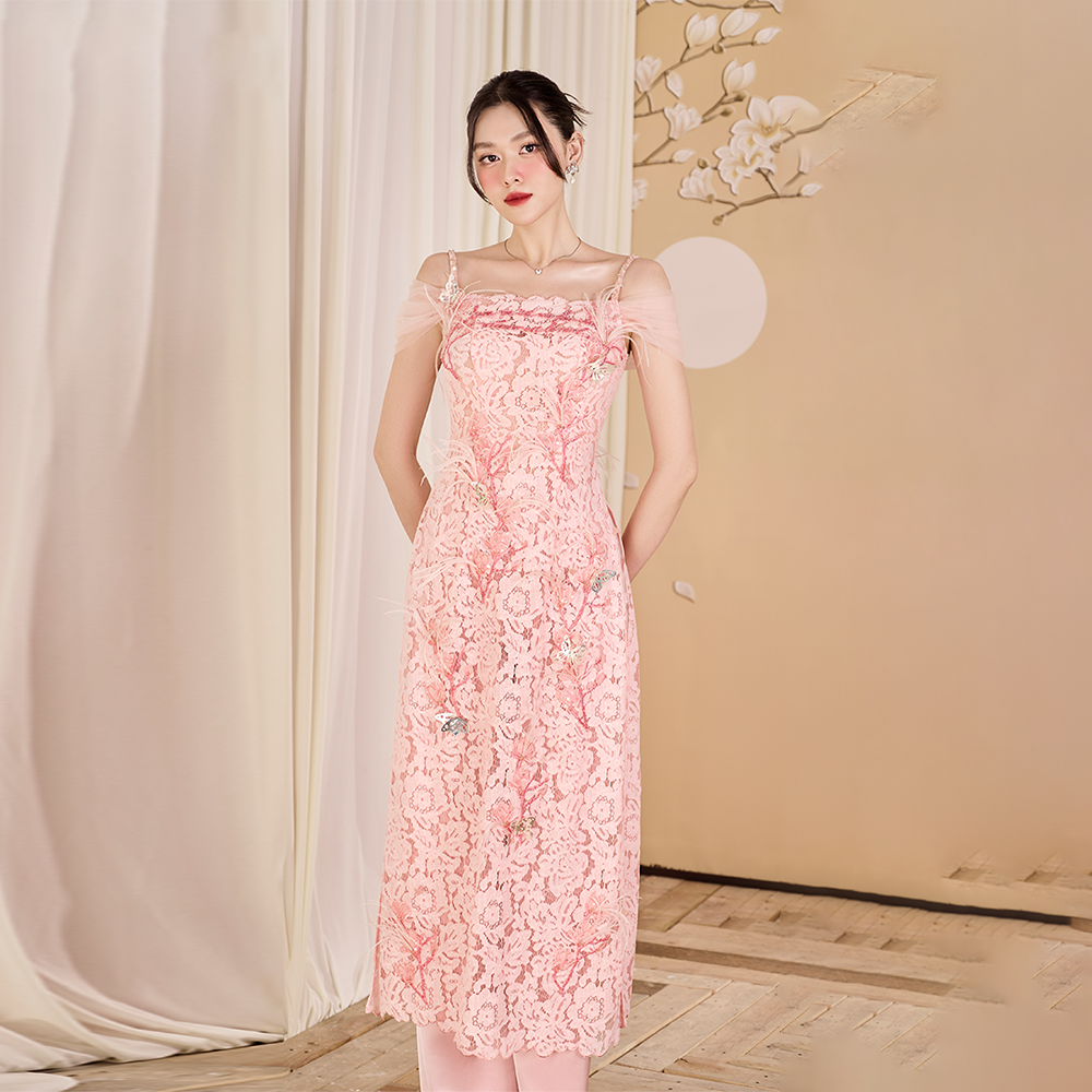 Explore designer dress shops for a stunning pink lace Ao Dai adorned with feathers. Elevate your style and make a statement! Shop Now!