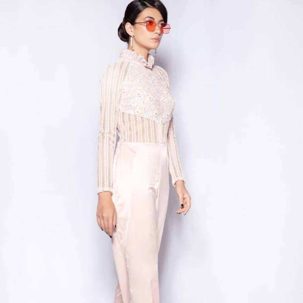 This cross-genre blouse is constructed from a combination of imported laces, stitched and appliqued together 