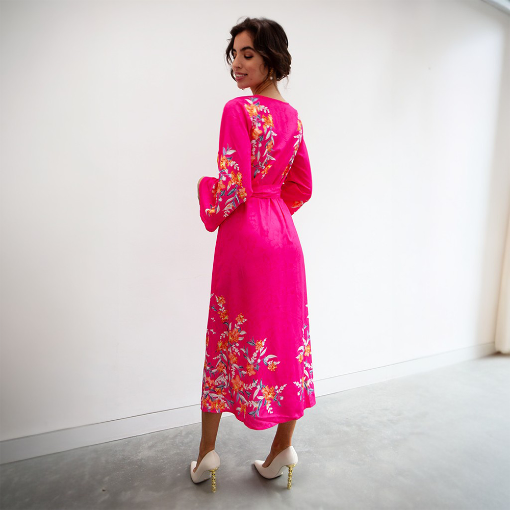 This bright hot pink midi dress features a V neckline, tie-up belt and full length sleeves.