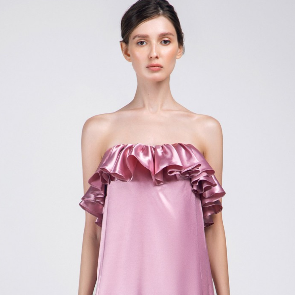 This is a loose long length party wear outfit. A unique ready-to-wear dress. Adorned with a ruffle frill on the chest line.