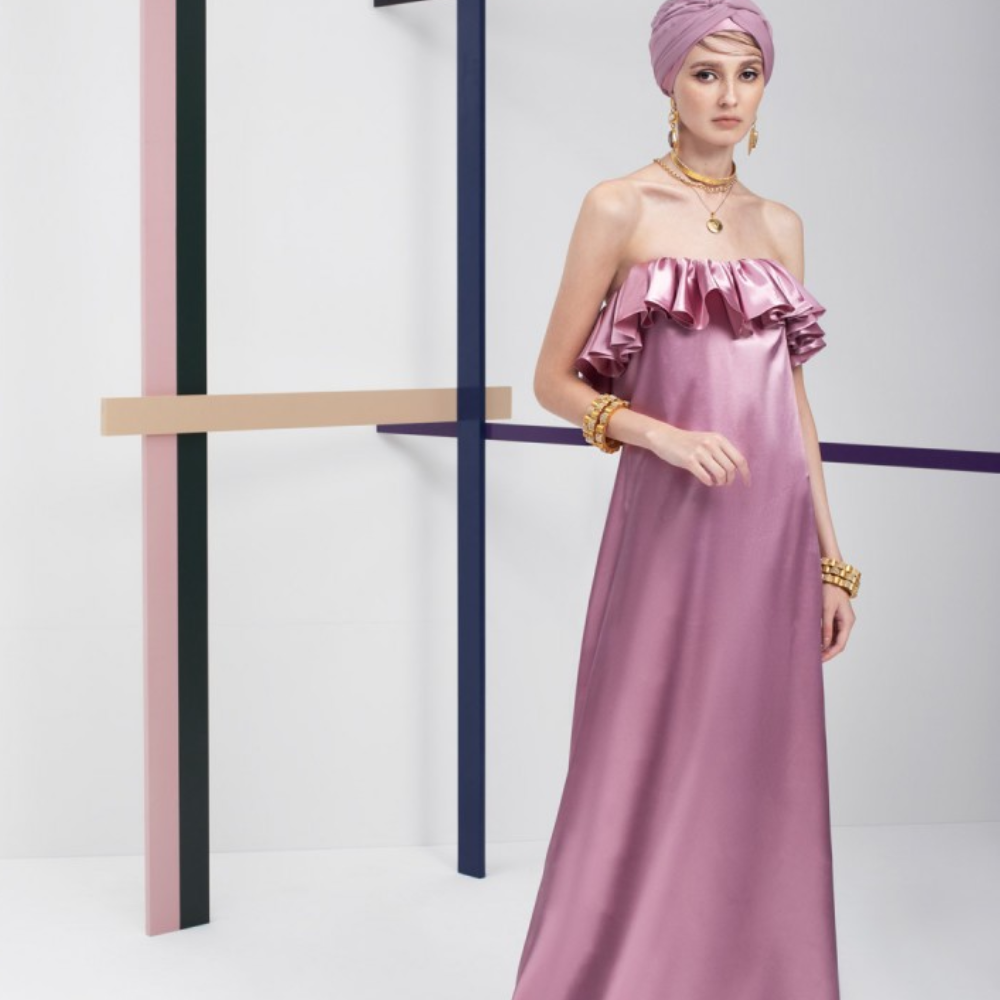 This is a loose long length party wear outfit. A unique ready-to-wear dress. Adorned with a ruffle frill on the chest line.