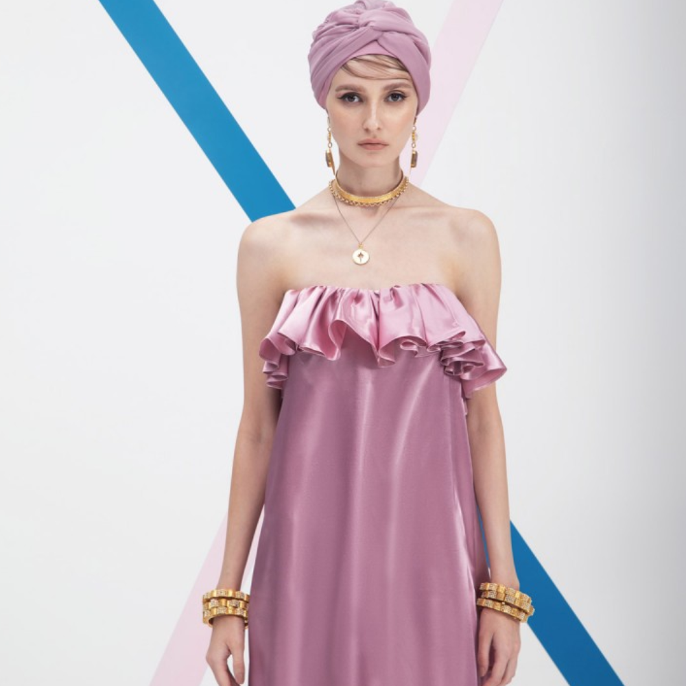 This is a loose long length party wear outfit. A unique ready-to-wear dress. Adorned with a ruffle frill on the chest line.