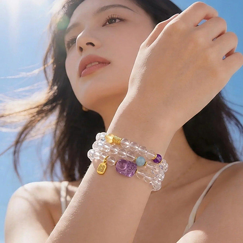 Discover the Pixiu Clear Quartz, Amethyst & Aquamarine Wrap Bracelet at The Luxe Maison, featuring natural crystals and a symbolic blessing charm.