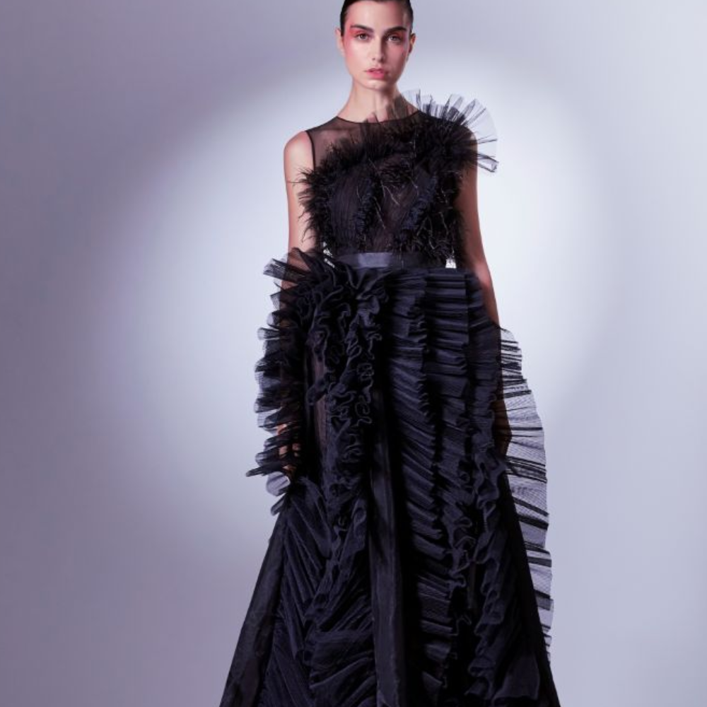 A mix of boldness and sensuality, this daring dress boasts a draped tulle and ostrich feathers corset. 